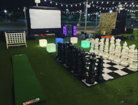 Guests enjoying party rental games at a Florida birthday party